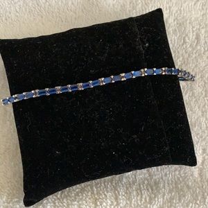 Sterling silver tennis bracelet with blue stone
